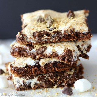 These Nutella S'mores Bars are the ultimate s'mores treat, filled with Nutella, marshmallow creme, chocolate chips, and a dusting of graham cracker crumbs.