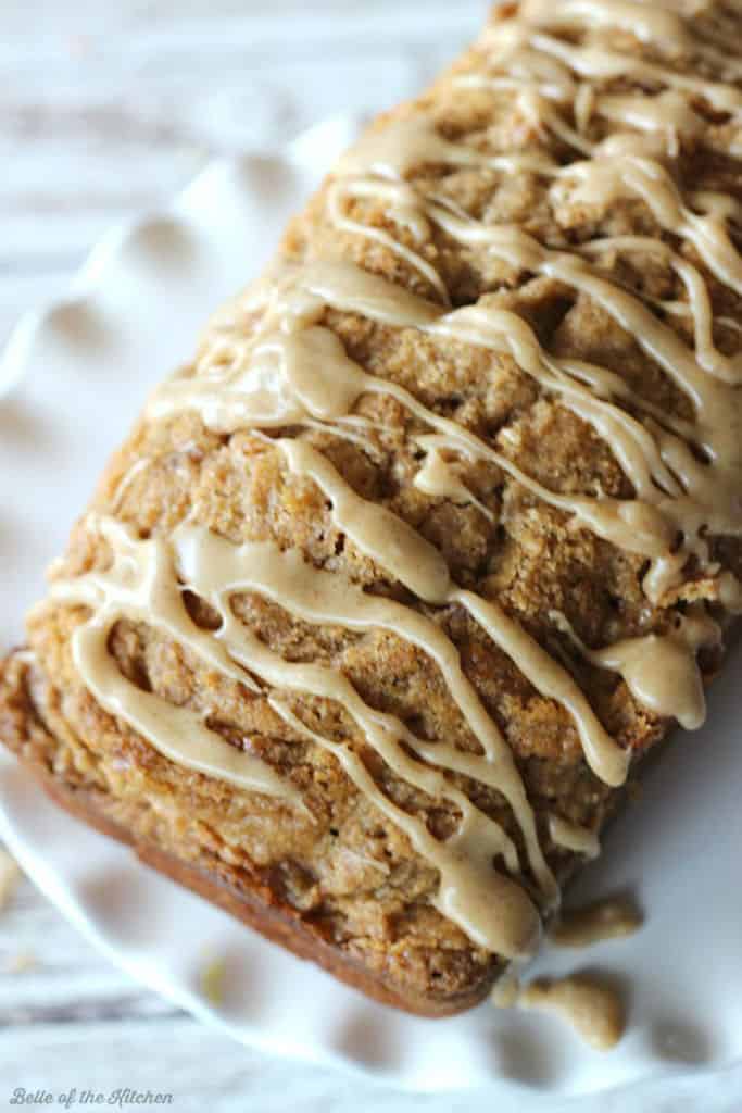 A close up of a loaf of pumpkin bread on a white plate