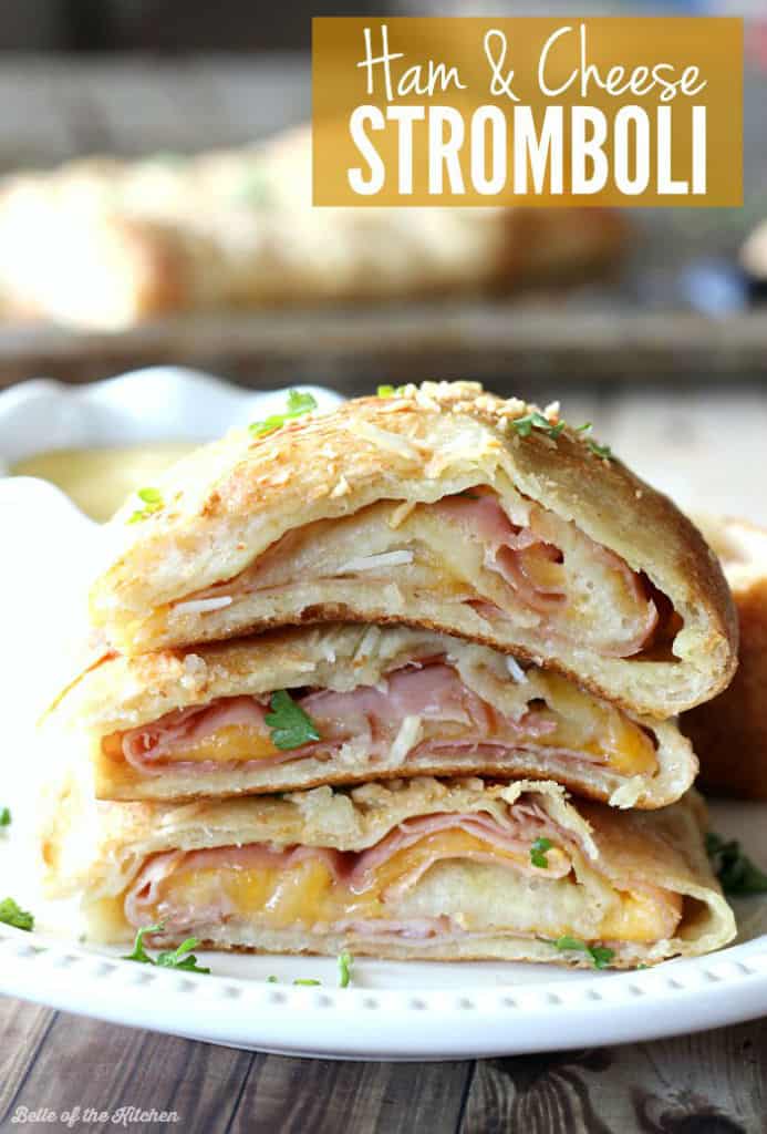 This Ham and Cheese Stromboli is SO GOOD! Pizza crust is stuffed with honey mustard, monterrey jack cheese, and smoky Black Forest Ham, then baked to a crispy and cheesy perfection!