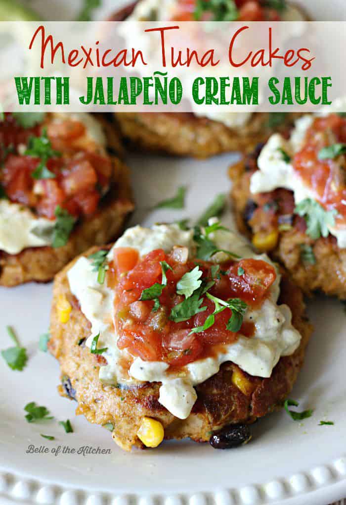 A plate full of tuna cakes topped with salsa, cilantro, and avocado