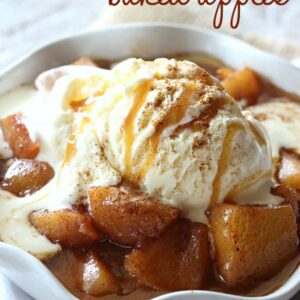 A bowl of baked apples and ice cream