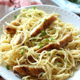 Tender pasta and juicy grilled chicken is mixed with a cheesy sauce to make this Cheesy Garlic Chicken Spaghetti.