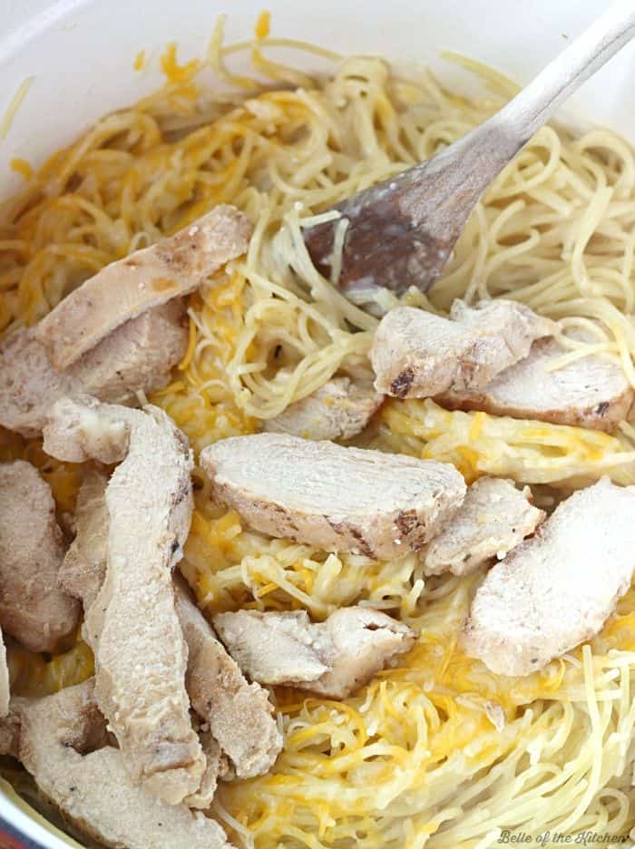 A dish is filled with food, with Chicken and Pasta