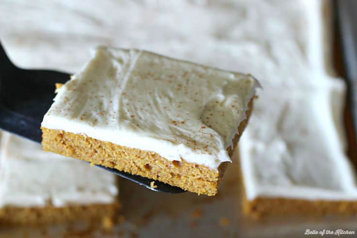 A piece of pumpkin bars with icing