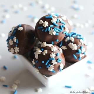 These Chocolate Cake Balls are made with crumbled cake and frosting, then dipped in melted chocolate and covered with sprinkles. The perfect easy treat!