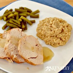 A plate of food turkey, green beans, and cauliflower