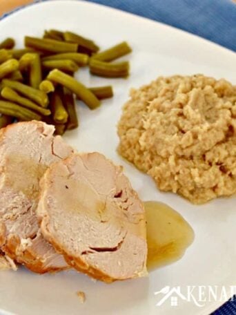 A plate of food turkey, green beans, and cauliflower