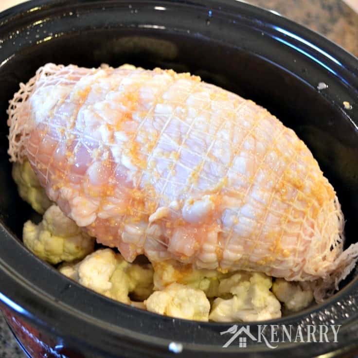 A pan filled with turkey and cauliflower 