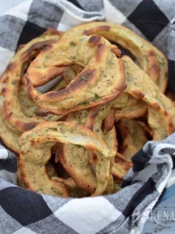 A close up of a bowl of onion rings