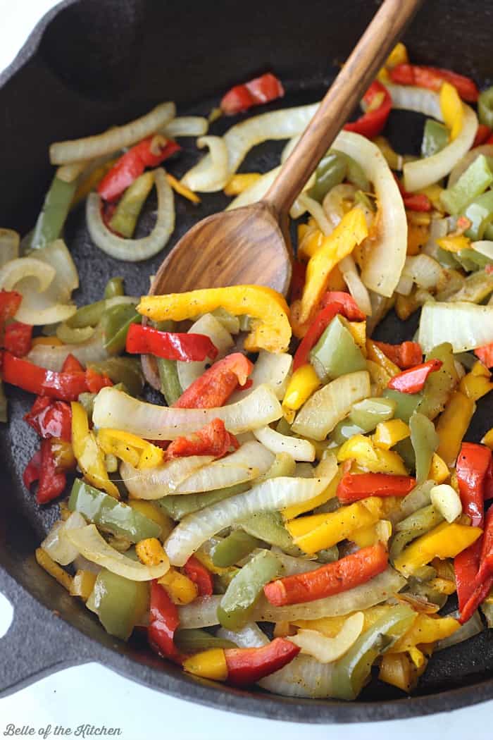a skillet of peppers and onions
