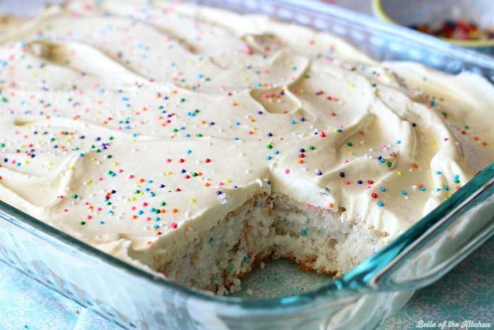 A close up of a piece of cake taken from a cake pan