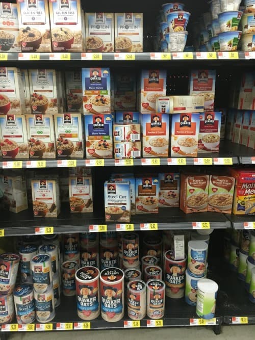 a store shelf with boxes of oatmeal