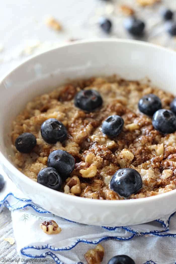 A bowl of oatmeal filled with blueberries