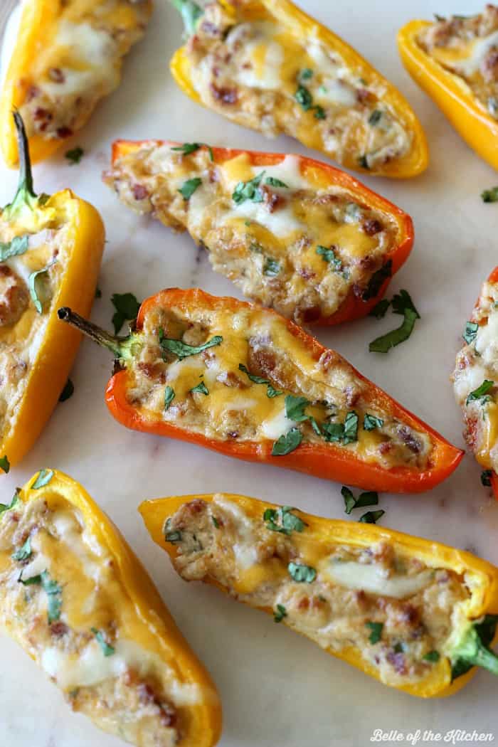 mini peppers filled with bacon, cream cheese, cheese, and cilantro
