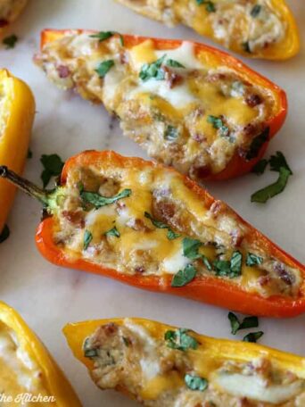 mini peppers filled with bacon, cream cheesem, cheese, and cilantro