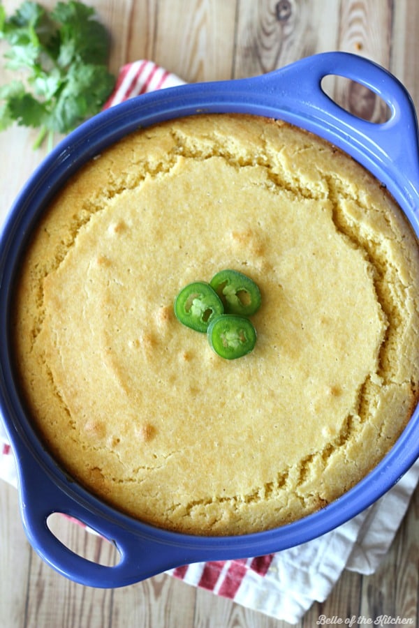 a bowl of chili cornbread casserole with sliced jalapeño on top