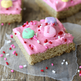 These Sugar Cookie Bars are so yummy and much easier to make than traditional sugar cookies! The dough is baked on one large cookie sheet, then topped with a homemade vanilla frosting.