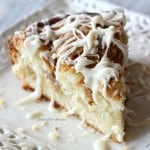 This Greek Yogurt Coffee Cake is out of this world good! It's sprinkled with a crumbly streusel topping then drizzled with a sweet vanilla glaze!