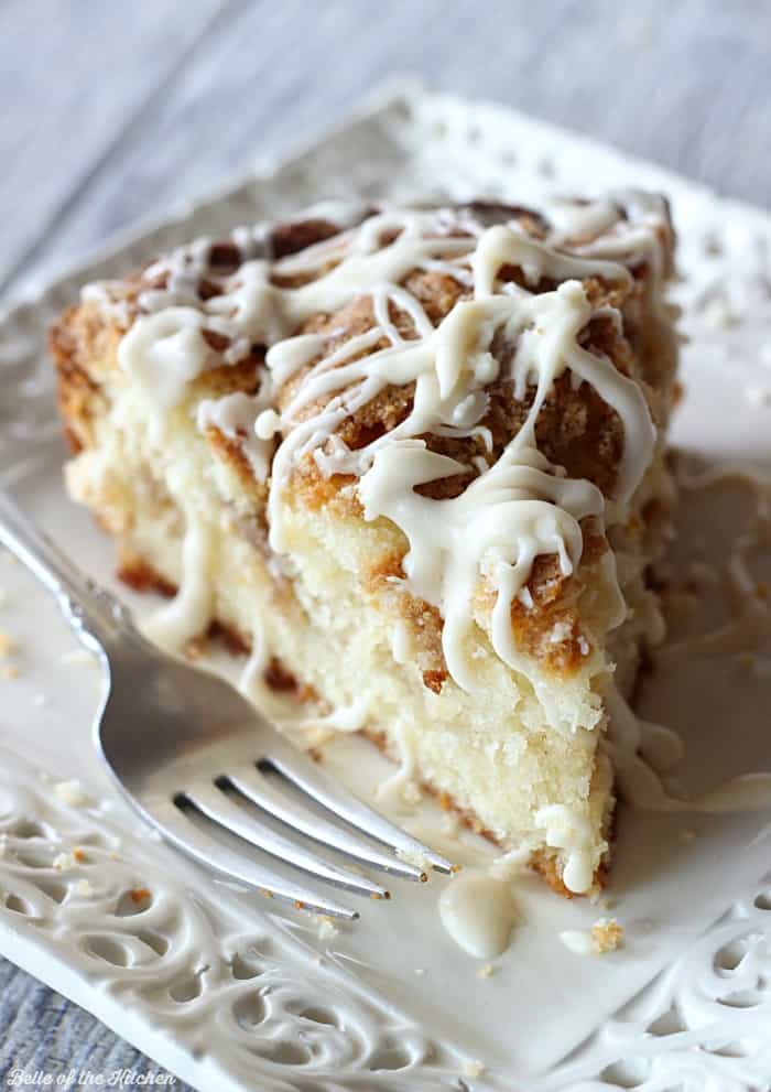 A piece of Coffee cake on a plate with a fork