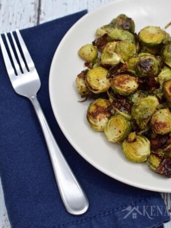 A plate of Brussels sprouts with a fork