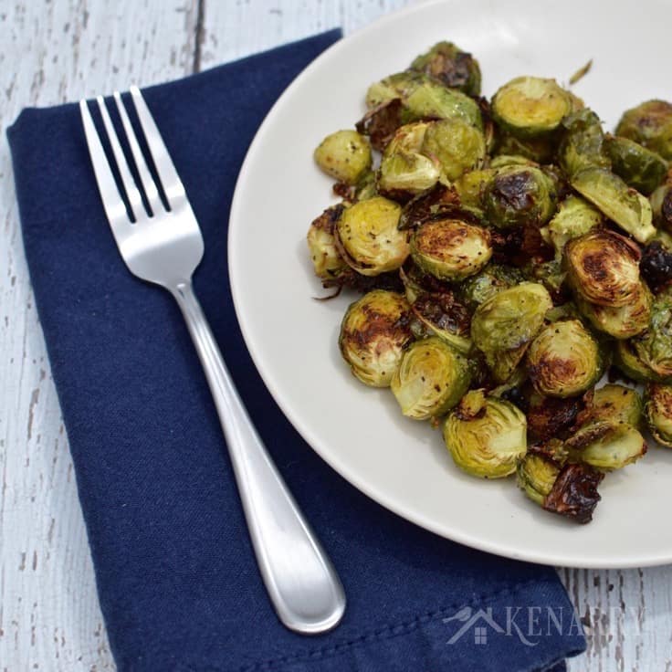 A plate of Brussels sprouts with a fork