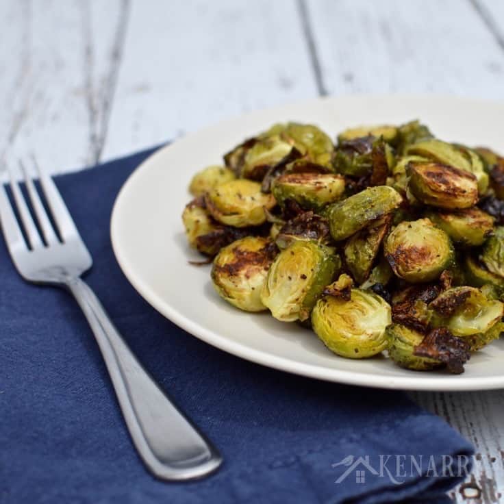 A plate of Brussels sprouts with a fork