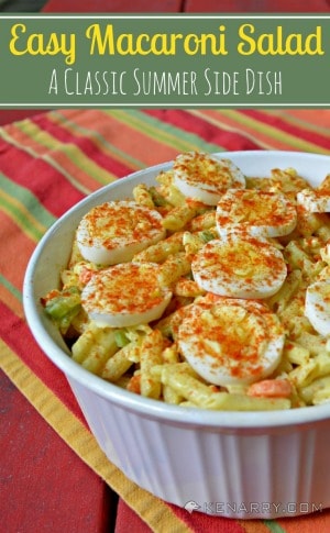 A bowl of macaroni salad with boiled eggs on top