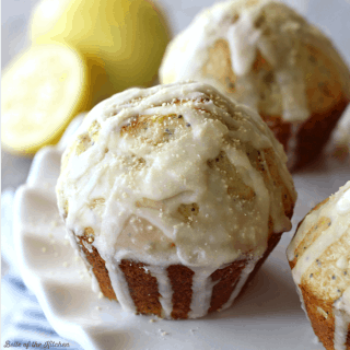 These Lemon Poppy Seed Muffins are bursting with sweet citrus flavor, and perfect for spring! They are finished with a drizzle of lemon glaze and honey sprinkles on top.