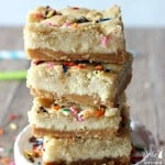 These Sugar Cookie Cheesecake Bars are the ultimate dessert! A layer of sugar cookies followed by a cheesecake filling, all on top of a irresistible Golden Oreo crust. You will LOVE these!