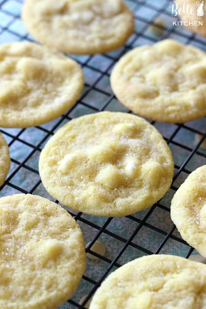 lemon cookies with white chocolate chips on a cooling rack