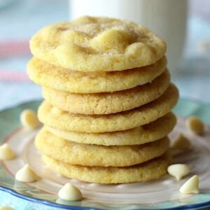 A close up of a stack of lemon cookies with white chocolate chips