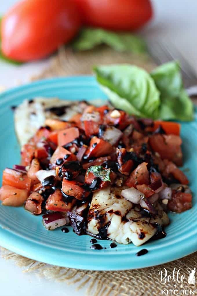 A plate of tilapia with Tomato and Basil