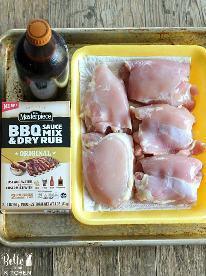 A tray of food, with Chicken thighs, root beer, and bbq rub