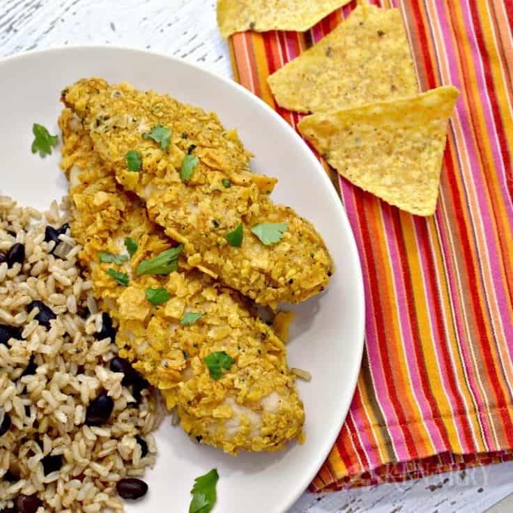 A plate of chicken tenders with rice and beans