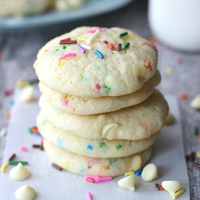 a stack of cookies with sprinkles and white chocolate chips