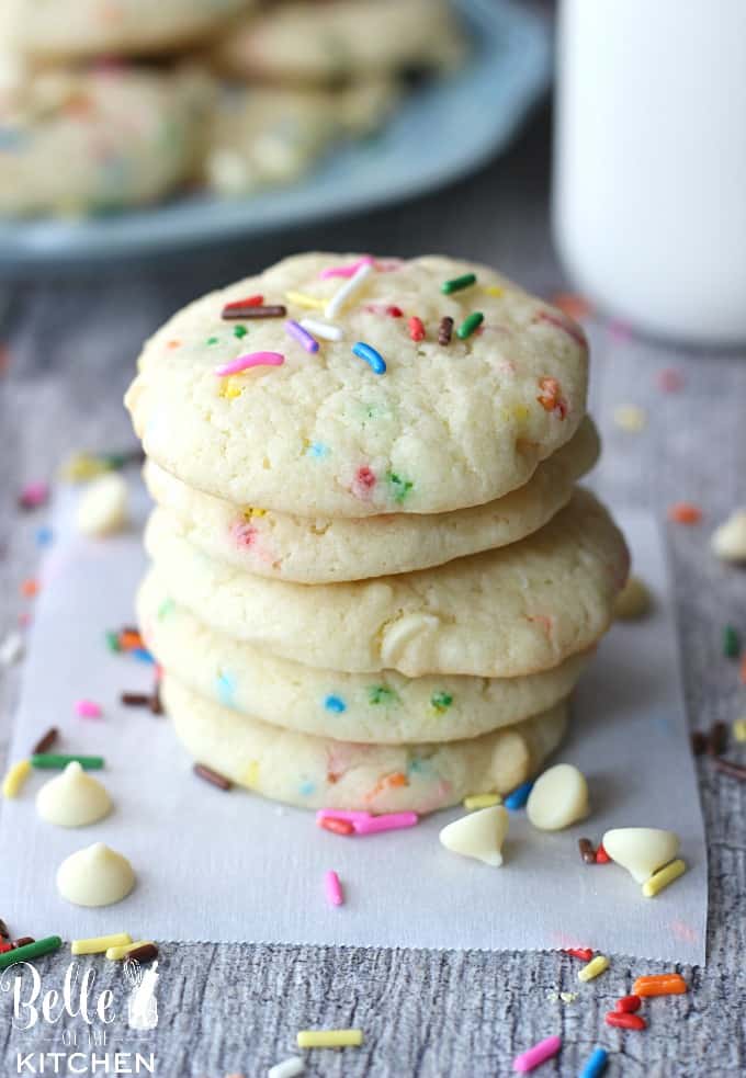 a stack of cookies with sprinkles and white chocolate chips
