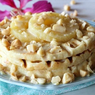 Pineapple Mac Nut Waffles - a tropical treat that's worth waking up for! Homemade waffles loaded with chopped pineapple, macadamia nuts, coconut, and more.