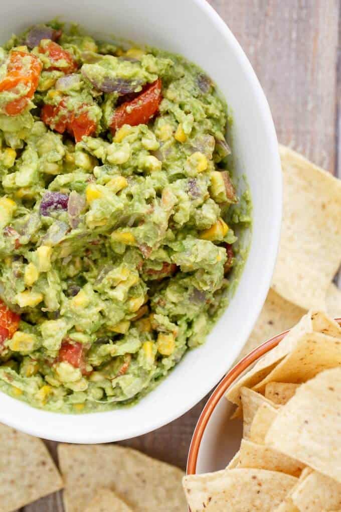 A bowl of food, with Guacamole and Bacon