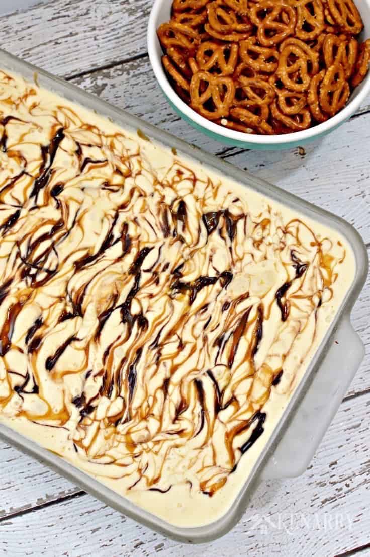 dish of ice cream cake beside a bowl of pretzels
