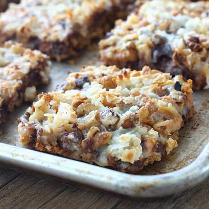 A close up of magic bars on a sheet pan