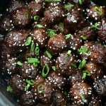 Crockpot Honey Sriracha Meatballs - yummy meatballs cooked in the crockpot in a tangy sauce with a kick of Sriracha. These make for an easy appetizer or a main dish served over rice!