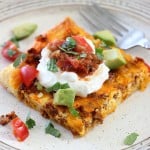 This Chorizo Breakfast Pizza is a yummy and savory dish for your next brunch. Buttery crescent dough is baked with chorizo sausage, eggs, and cheese, then sprinkled with all of your favorite taco-style toppings! It's perfect for a crowd, or as breakfast-for-dinner, too!