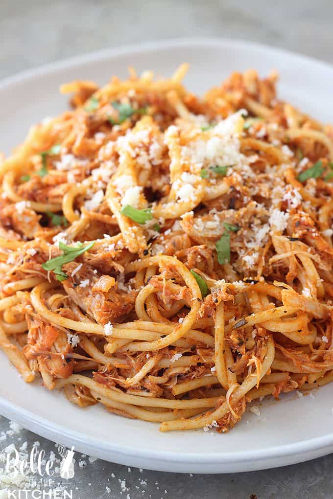 A close up of a plate of food, with pasta and cheese