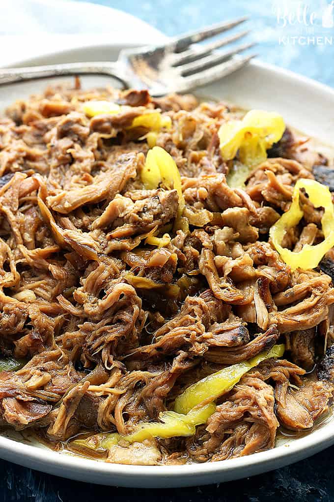 A dish is filled with shredded pork and peppers