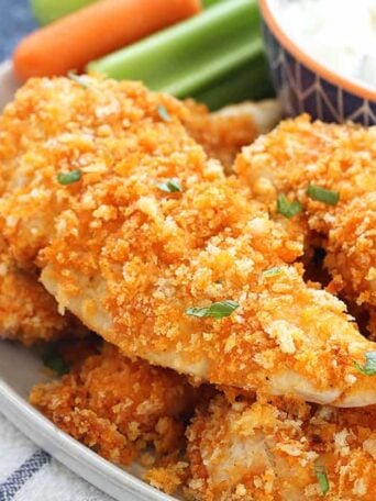 A close up of a plate of Chicken fingers