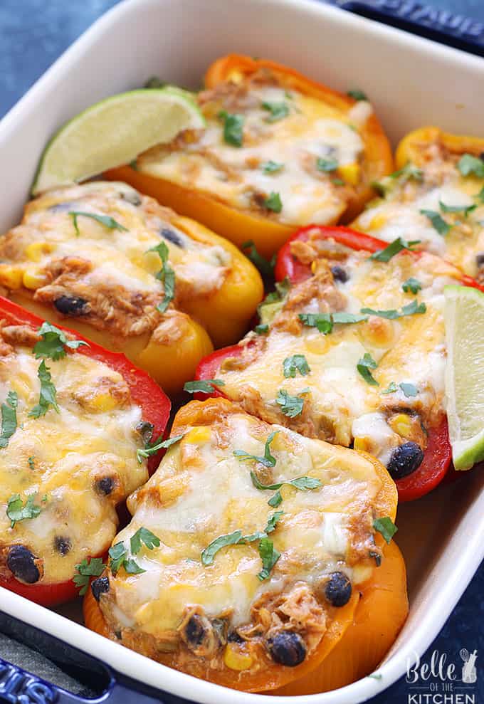 A dish is filled with filled peppers slice in half