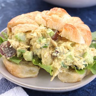 This Greek Yogurt Curry Chicken Salad is simple to make and super flavorful! It's lightened up and packed with protein thanks to Greek yogurt. It tastes amazing as a sandwich, salad, or with pita chips and veggies!