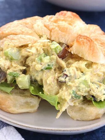 A close up of a chicken salad sandwich on a plate