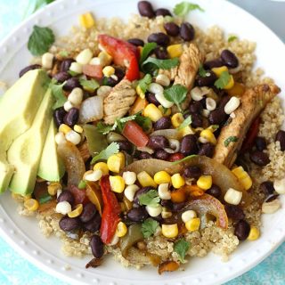 These Skillet Chicken Fajita Quinoa Bowls are made with marinated chicken, peppers, onions, and a homemade corn salsa. Serve over cooked quinoa for a healthy and delicious weeknight dinner!