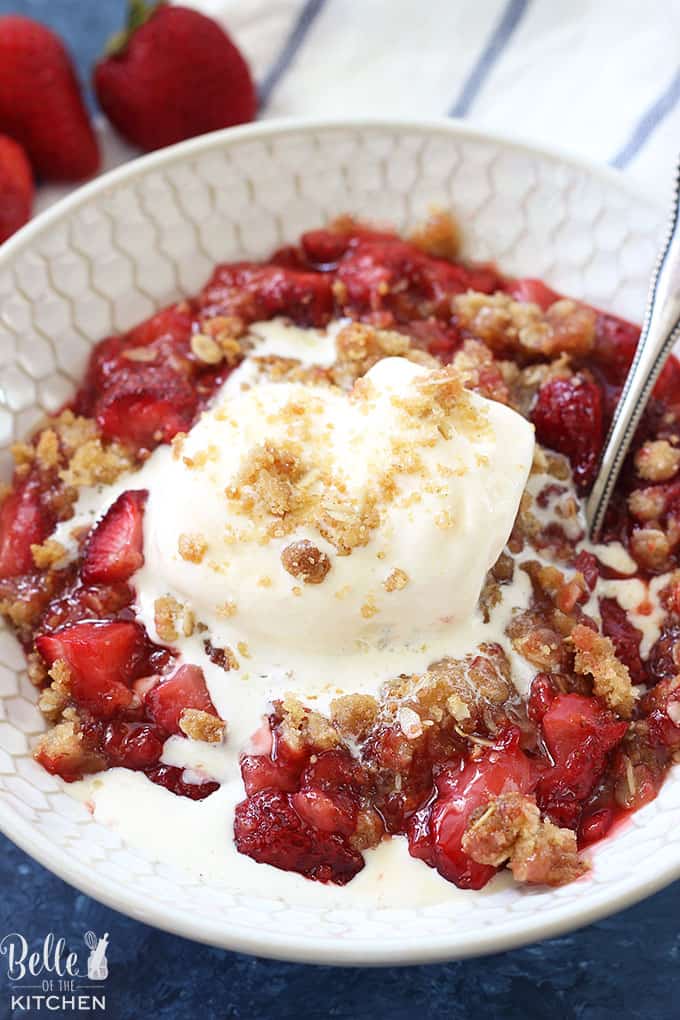 This Strawberry Crisp is the best summer dessert ever! Fresh juicy strawberries are topped with a buttery and crumbly oat topping, and is absolutely swoothworthy with a big scoop of vanilla ice cream on top!